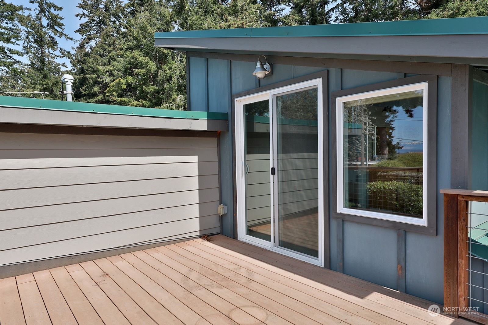 5880 Mutiny Bay Road Freeland, WA 98249 - Photo 32 of 40 a front view of a house with a garden