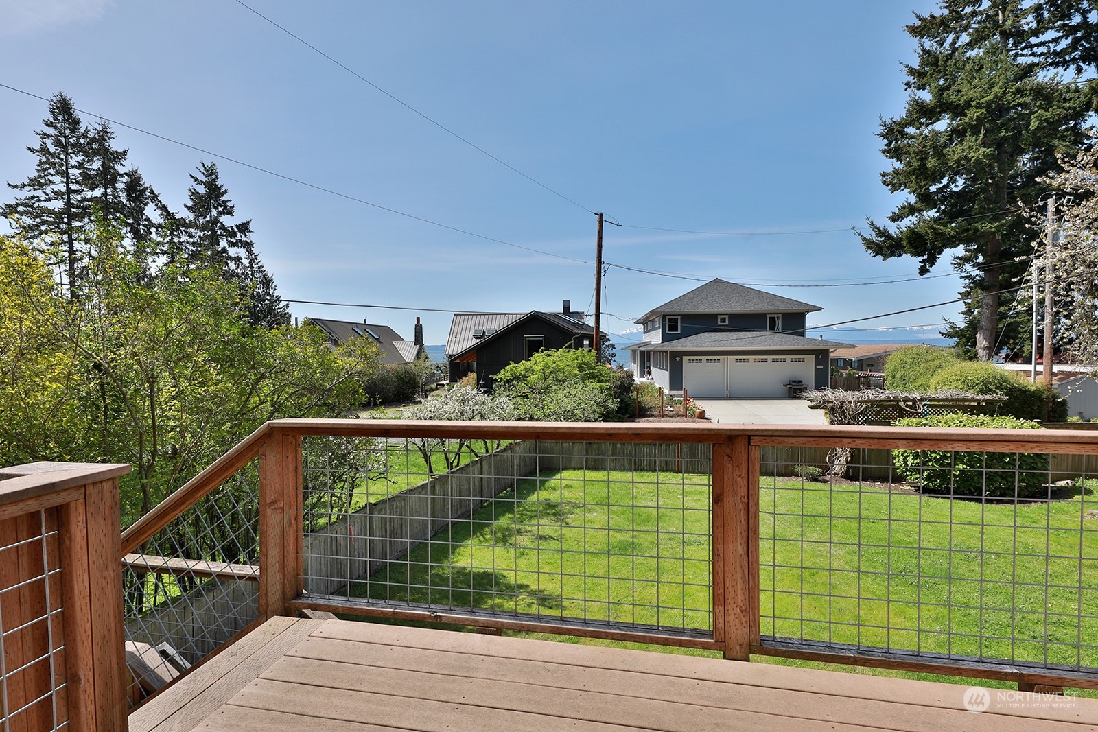 5880 Mutiny Bay Road Freeland, WA 98249 - Photo 40 of 40 a view of a deck with a large window and wooden fence