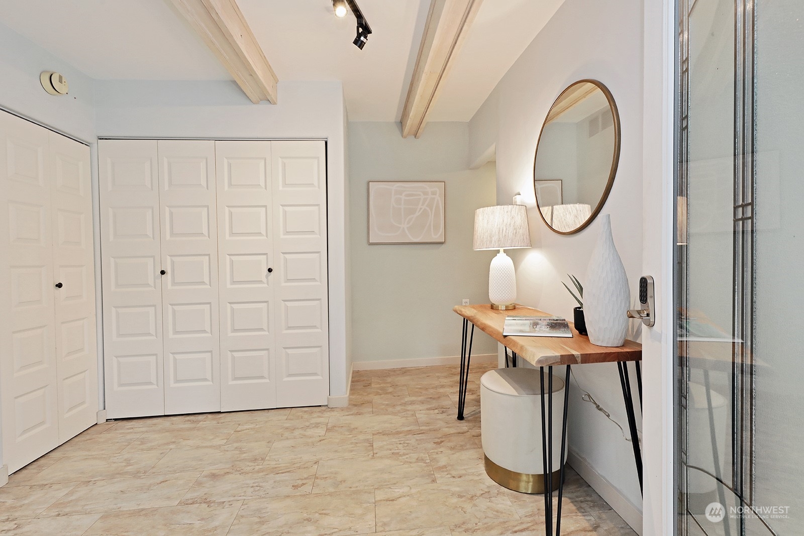 5880 Mutiny Bay Road Freeland, WA 98249 - Photo 8 of 40 a workspace with wooden floor mirror and white walls