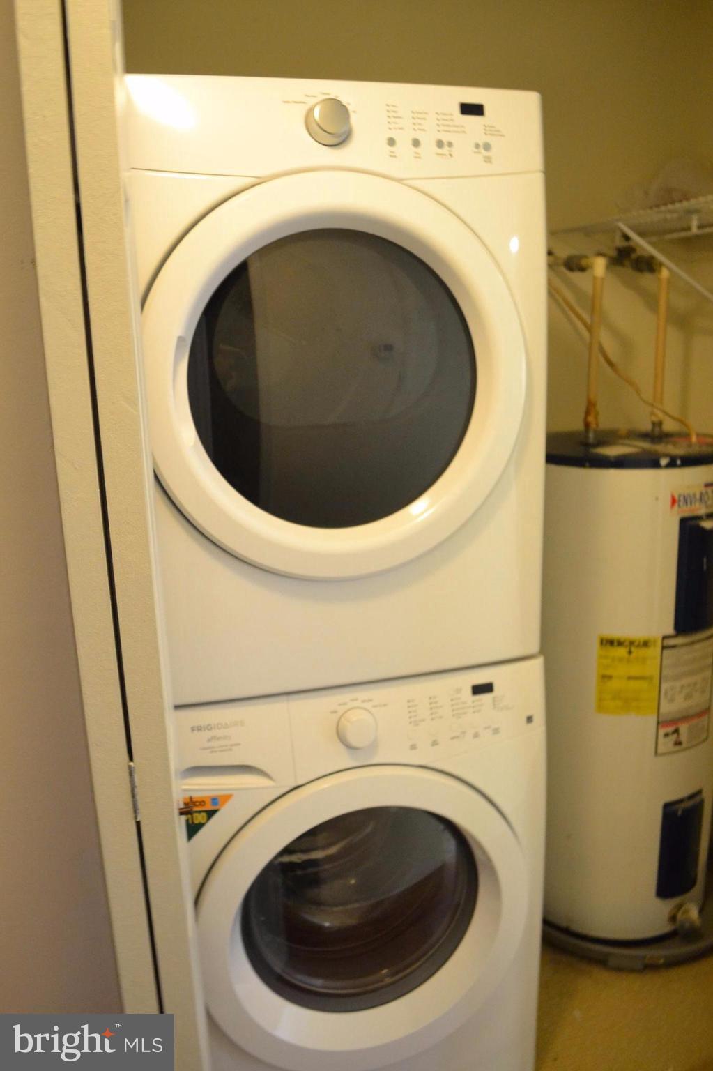 12900 Rousby Hall Road Lusby, MD 20657 - Photo 4 of 8 a utility room with dryer and washer