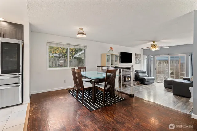 a view of a dining room with furniture window and wooden floor