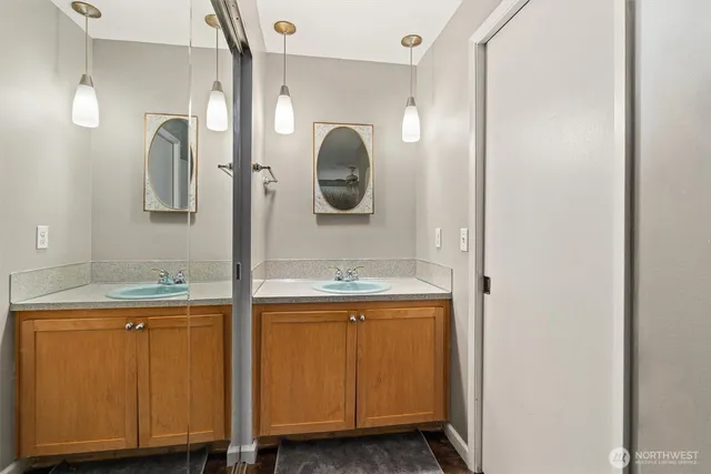 a bathroom with a sink and a mirror