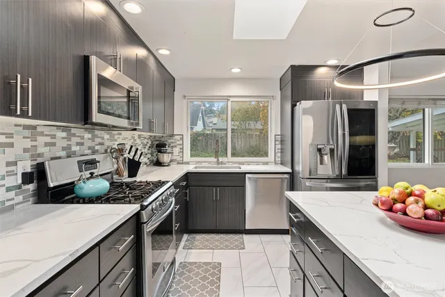 a kitchen with a sink stove and cabinets