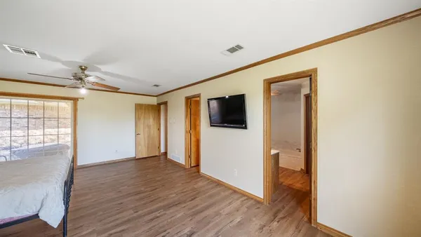 a view of a livingroom with wooden floor