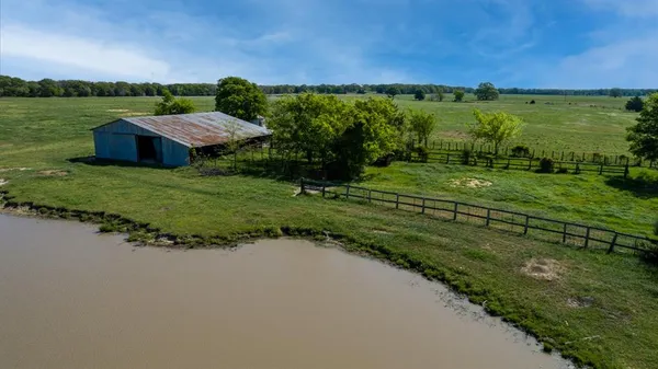 a view of a lake with a big yard
