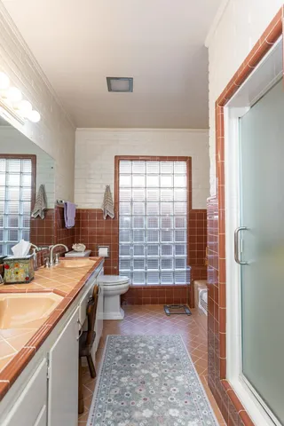 a room with a washing machine and a rug