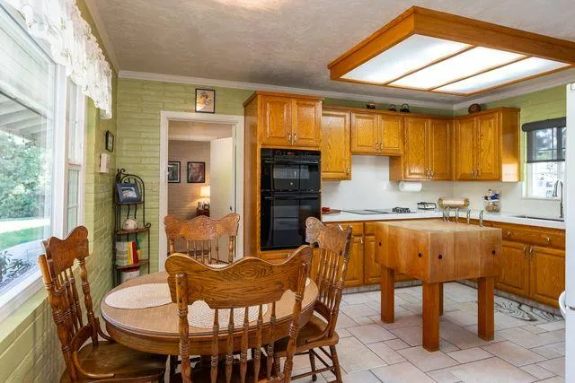 a dining room with furniture and window