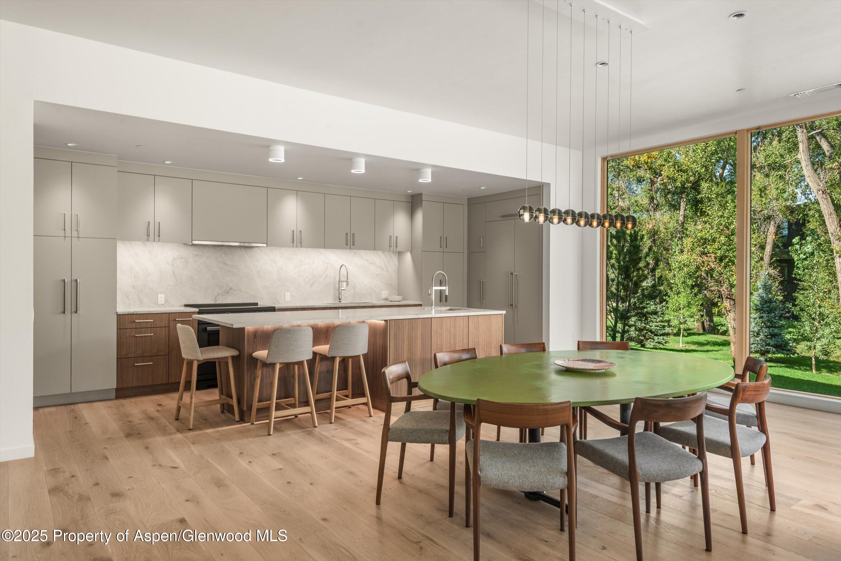 103 Willow Road, Unit 101 Basalt, CO 81621 - Photo 6 of 12 a dining room with furniture and wooden floor