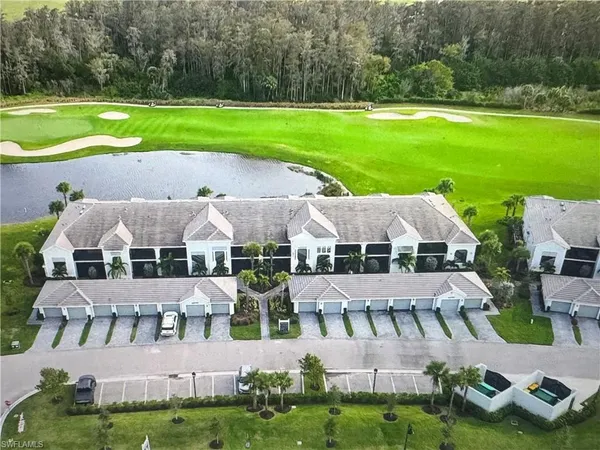 an aerial view of a house with big yard