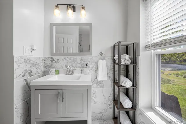 a bathroom with a sink and a mirror