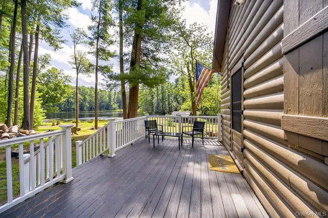 an outdoor view with sitting space and large trees