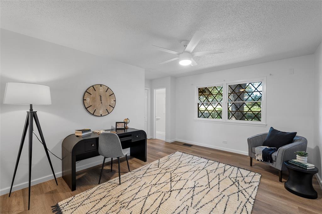 925 Church Road McGregor, TX 76657 - Photo 19 of 40 a view of a workspace with furniture and wooden floor