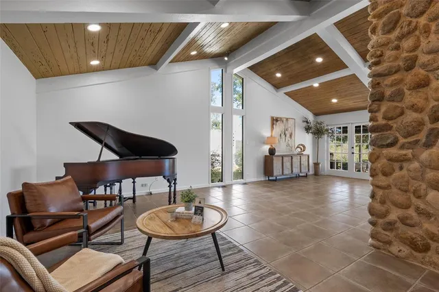 a lobby with furniture and wooden floor