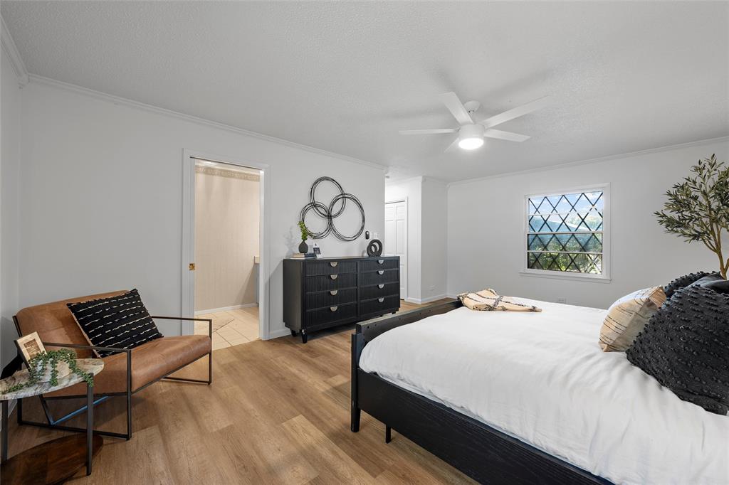 925 Church Road McGregor, TX 76657 - Photo 27 of 40 a bedroom with a bed window and a table