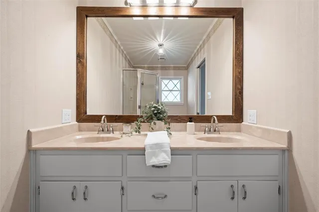 a bathroom with a sink and a mirror