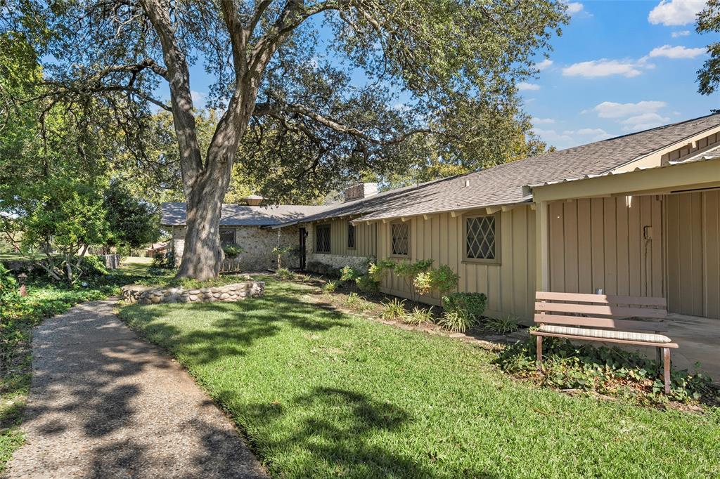 925 Church Road McGregor, TX 76657 - Photo 3 of 40 a backyard of a house with yard and outdoor seating