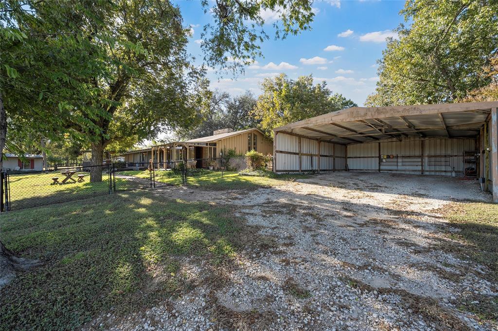 925 Church Road McGregor, TX 76657 - Photo 35 of 40 a view of a house with a yard