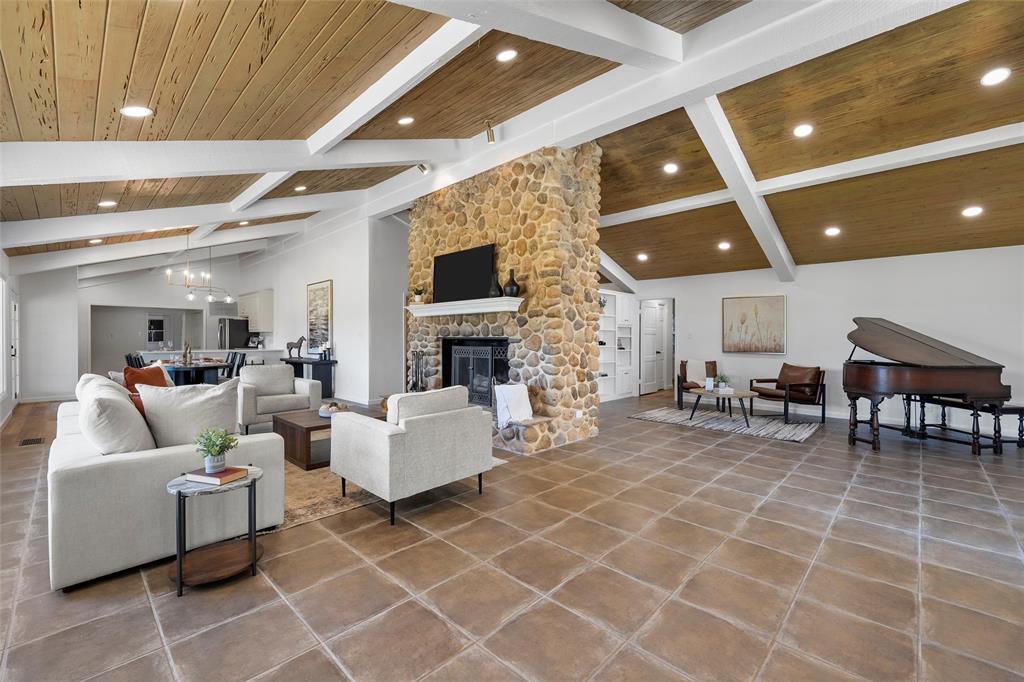 925 Church Road McGregor, TX 76657 - Photo 6 of 40 a living room with furniture a flat screen tv and a fireplace