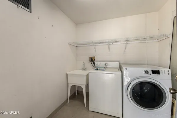 a utility room with dryer and washer
