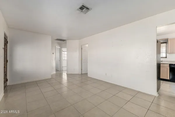 a view of an empty room with a fireplace