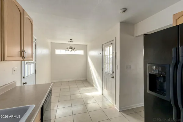 a kitchen with stainless steel appliances granite countertop a refrigerator and a sink
