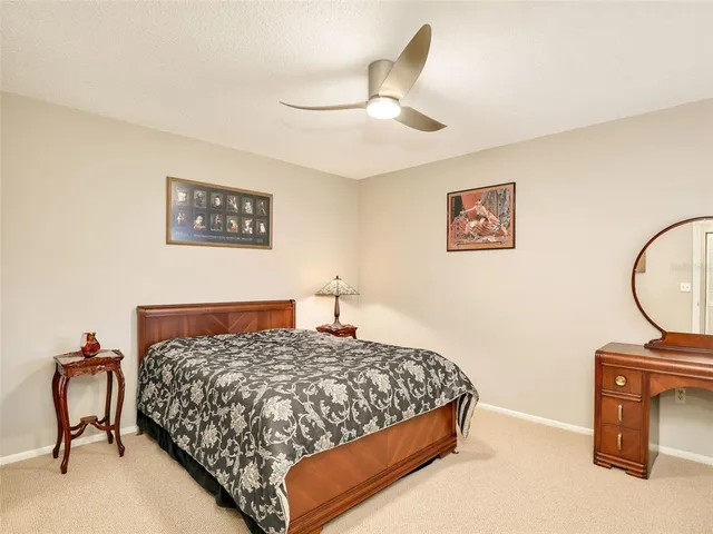 a bedroom with a bed and a chair