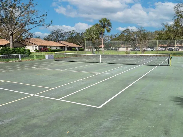 a view of an outdoor space and tennis court
