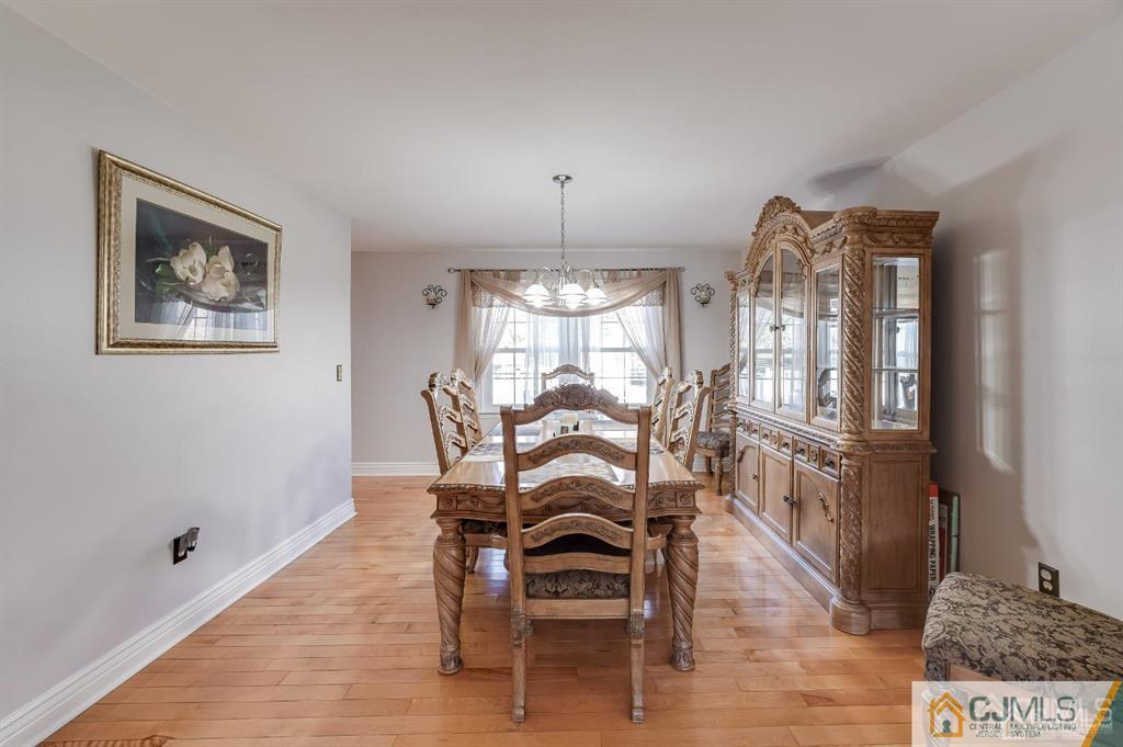 5 Starkin Road East Brunswick, NJ 08850 - Photo 11 of 34 a dining room with furniture and window