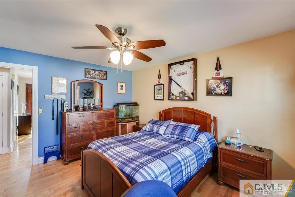 5 Starkin Road East Brunswick, NJ 08850 - Photo 15 of 34 a bedroom with a bed and a dresser in it