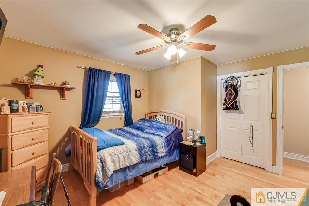 5 Starkin Road East Brunswick, NJ 08850 - Photo 17 of 34 a bedroom with a bed and a dresser