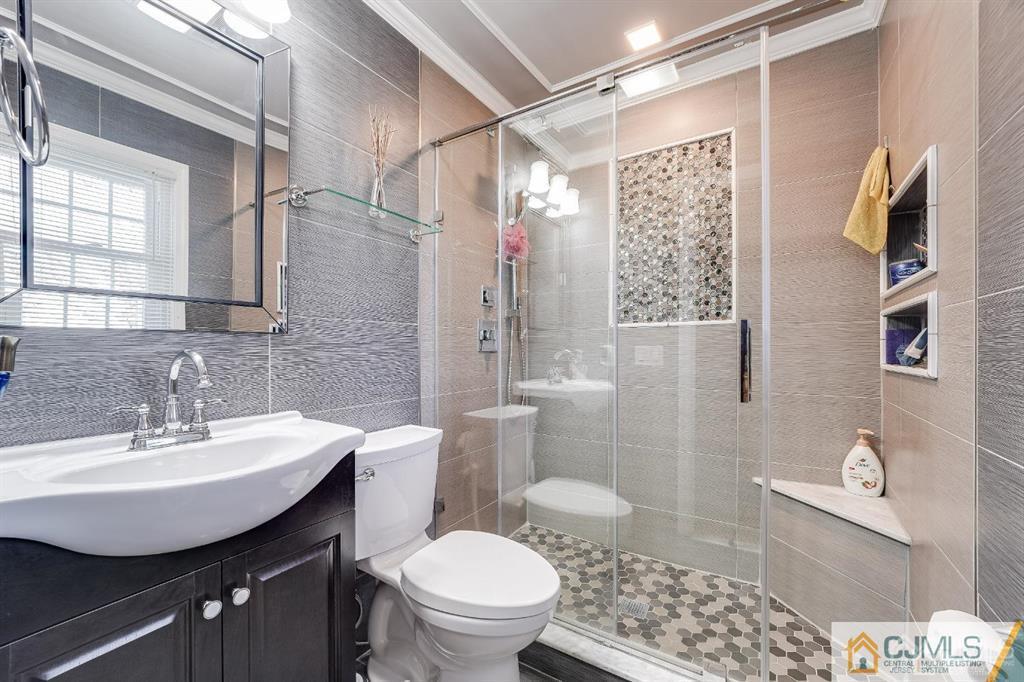 5 Starkin Road East Brunswick, NJ 08850 - Photo 19 of 34 a bathroom with a sink toilet and shower