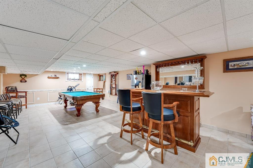 5 Starkin Road East Brunswick, NJ 08850 - Photo 20 of 34 a living room with furniture a table and chairs