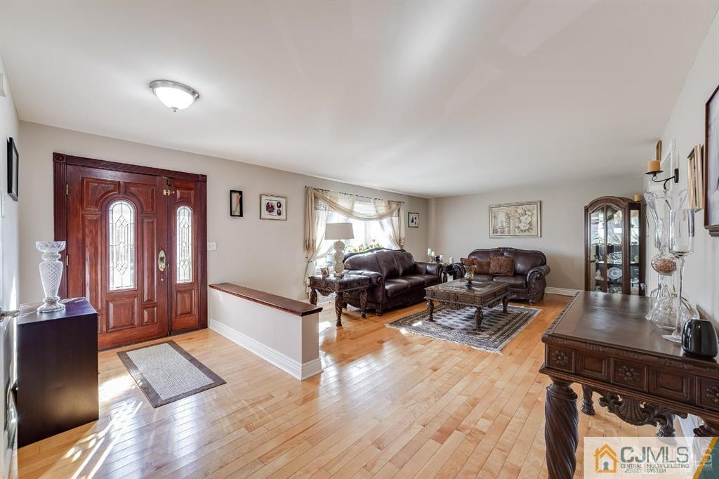 5 Starkin Road East Brunswick, NJ 08850 - Photo 2 of 34 a living room with furniture and wooden floor