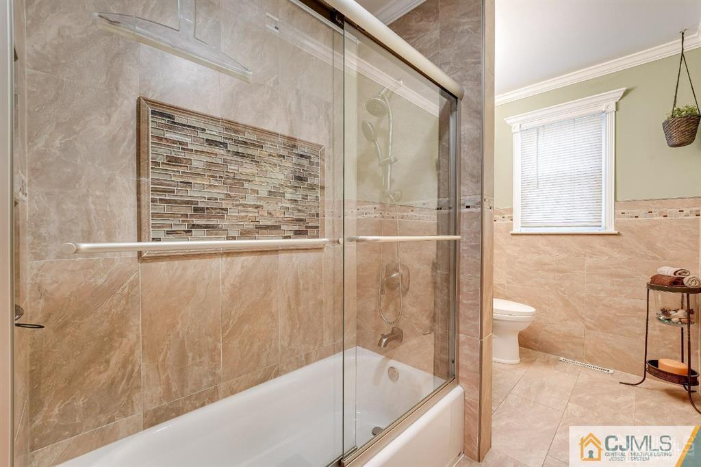 5 Starkin Road East Brunswick, NJ 08850 - Photo 23 of 34 a bathroom with a bathtub and a shower