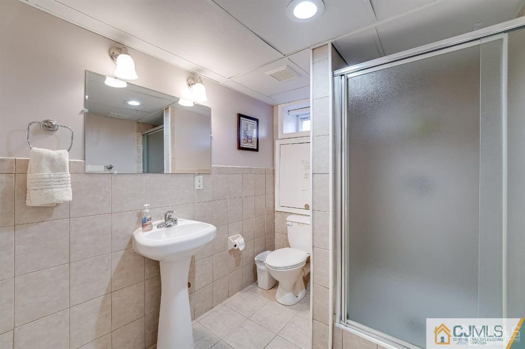 5 Starkin Road East Brunswick, NJ 08850 - Photo 24 of 34 a bathroom with a sink toilet and shower