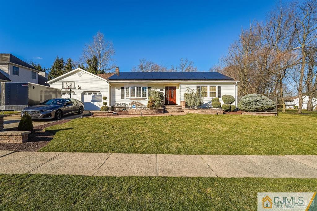 5 Starkin Road East Brunswick, NJ 08850 - Photo 28 of 34 a front view of a house with a yard