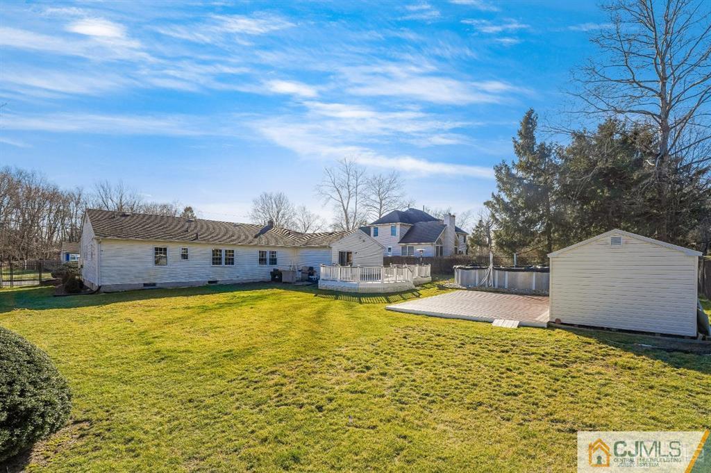 5 Starkin Road East Brunswick, NJ 08850 - Photo 30 of 34 a view of a swimming pool with an outdoor space and seating area