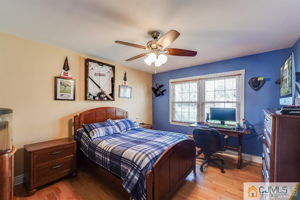 5 Starkin Road East Brunswick, NJ 08850 - Photo 4 of 34 a bedroom with a bed window and a desk