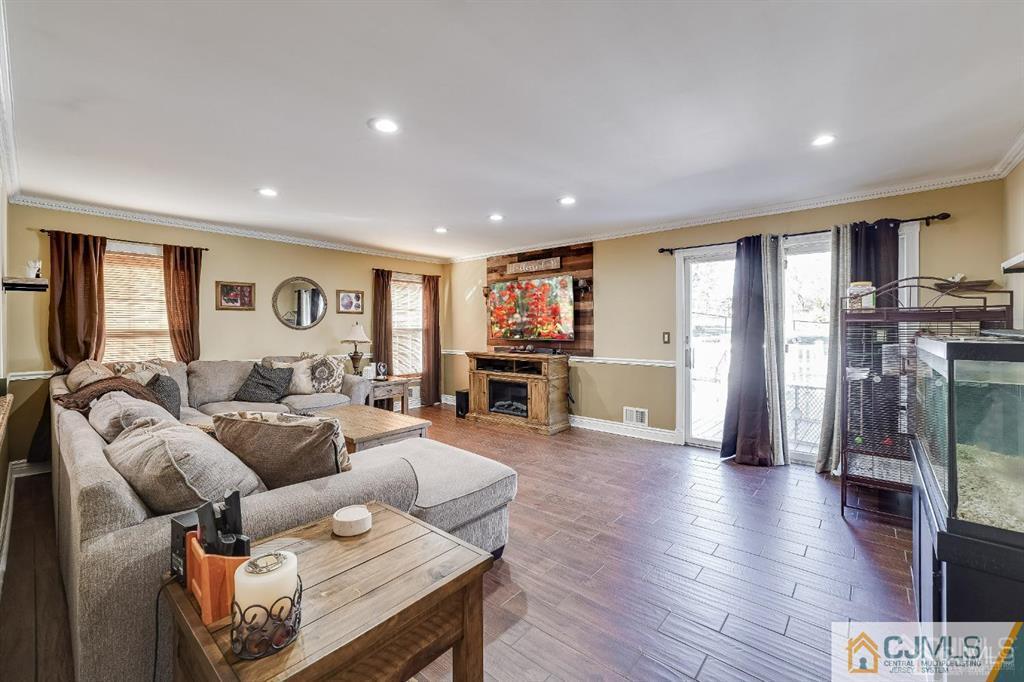 5 Starkin Road East Brunswick, NJ 08850 - Photo 7 of 34 a living room with furniture and a wooden floor