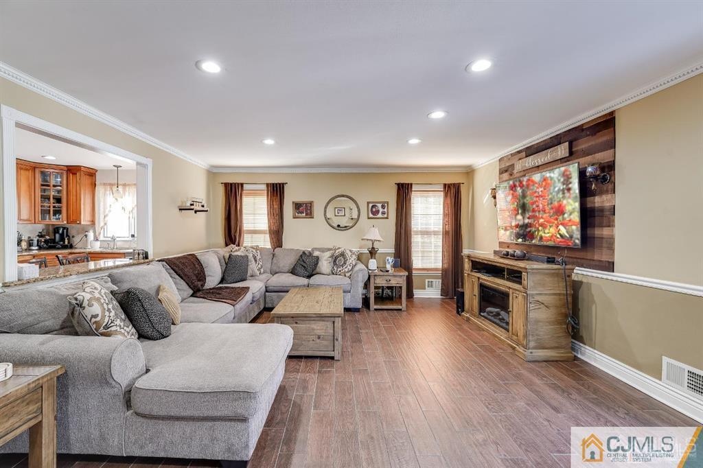 5 Starkin Road East Brunswick, NJ 08850 - Photo 8 of 34 a living room with furniture and a flat screen tv