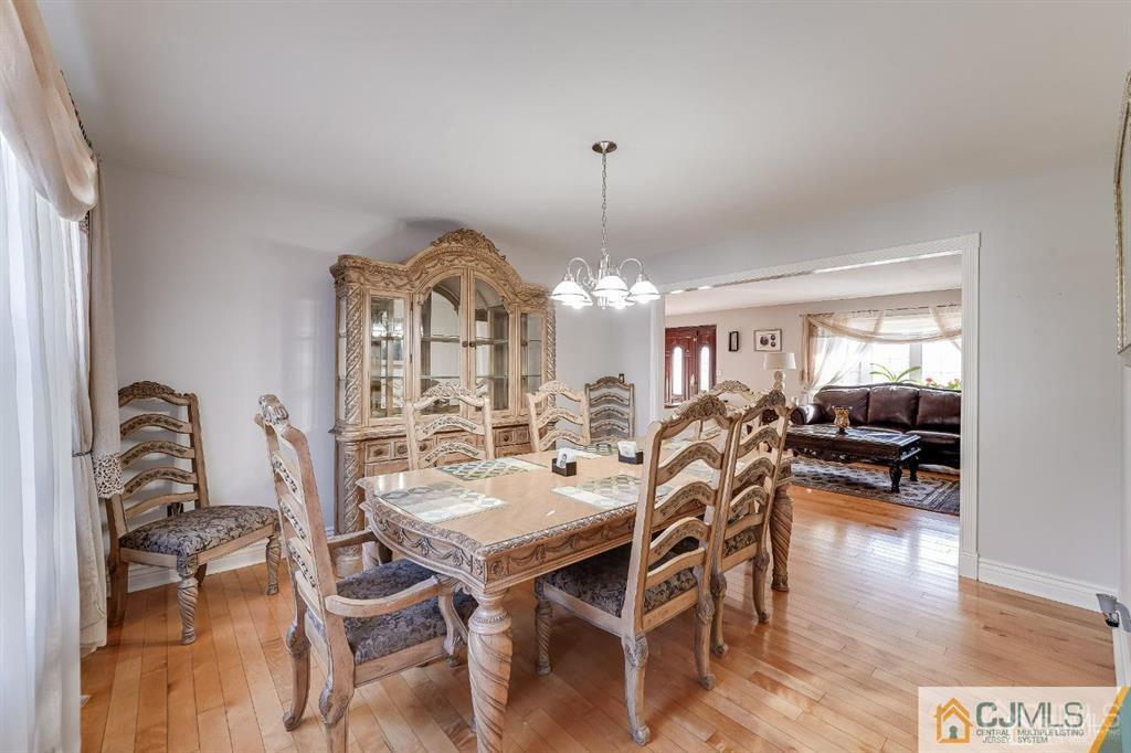 5 Starkin Road East Brunswick, NJ 08850 - Photo 10 of 34 a view of a dining room with furniture and wooden floor