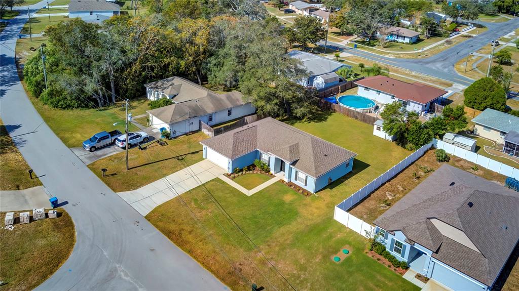 7325 Millstone Street Spring Hill, FL 34606 - Photo 13 of 46 Drone Front and Side View