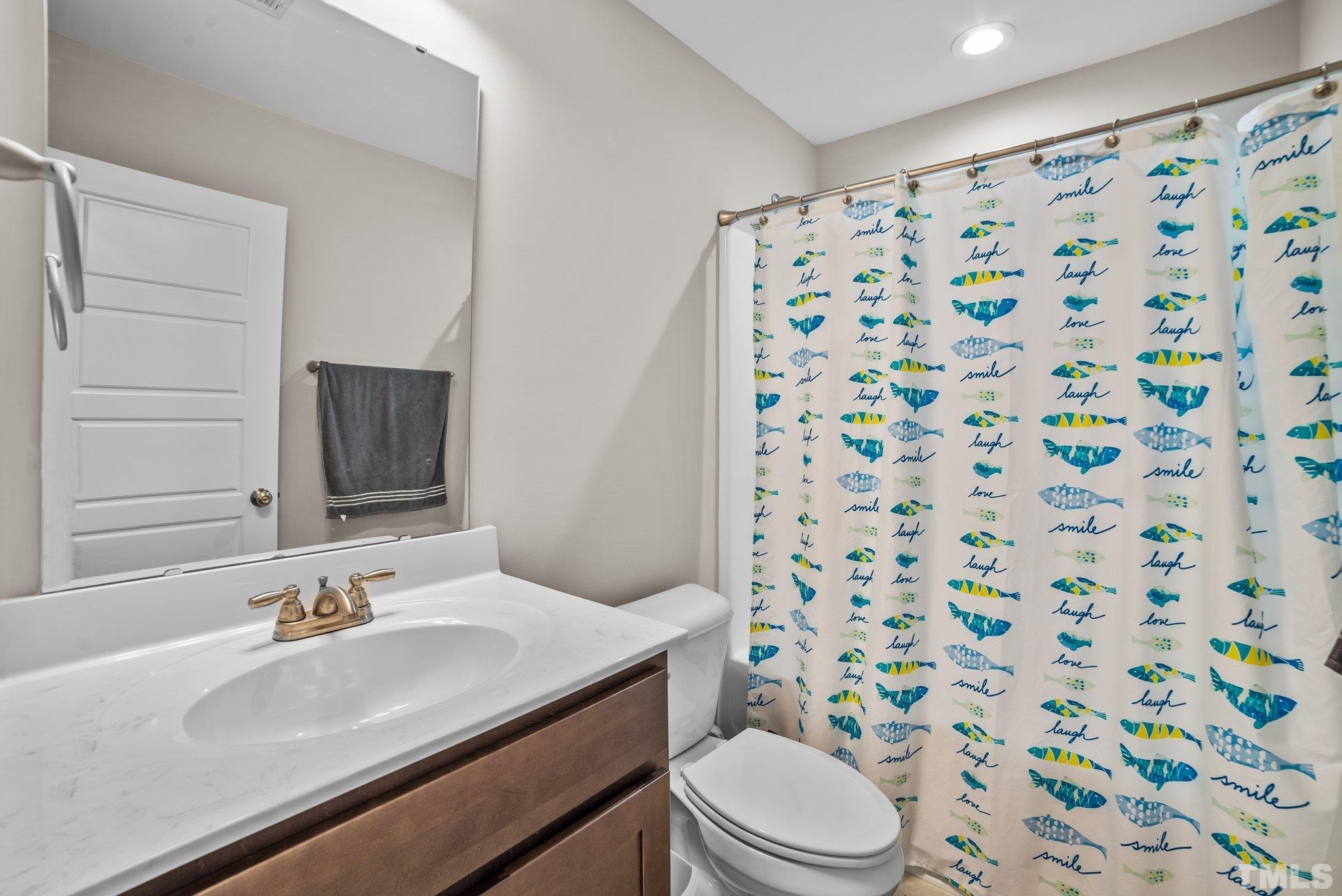 9701 Juniper Road Bailey, NC 27807 - Photo 31 of 44 a bathroom with a sink toilet and shower