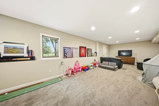 a bedroom with furniture and a flat screen tv