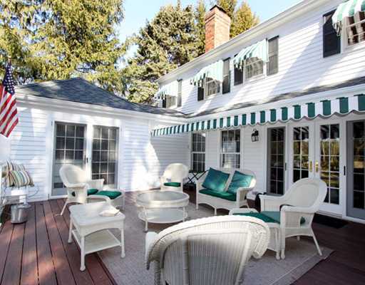 34 Lake Drive Riverside, CT 06878 - Photo 12 of 13 a view of a patio with couches table and chairs and potted plants