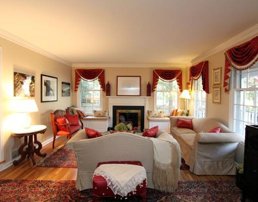 34 Lake Drive Riverside, CT 06878 - Photo 2 of 13 a living room with furniture and a fireplace