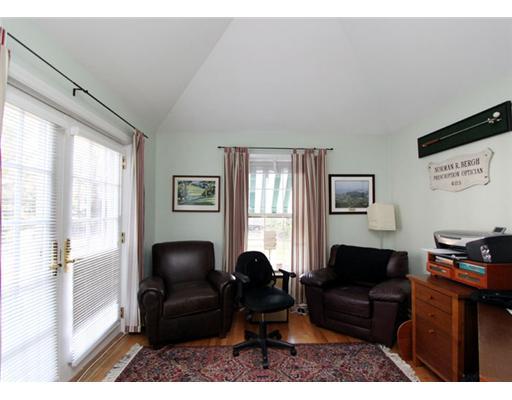 34 Lake Drive Riverside, CT 06878 - Photo 6 of 13 a living room with furniture a large window and a flat screen tv