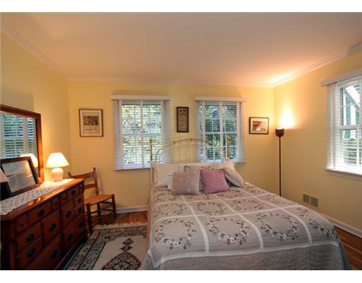 34 Lake Drive Riverside, CT 06878 - Photo 10 of 13 a bedroom with a bed and wooden floor