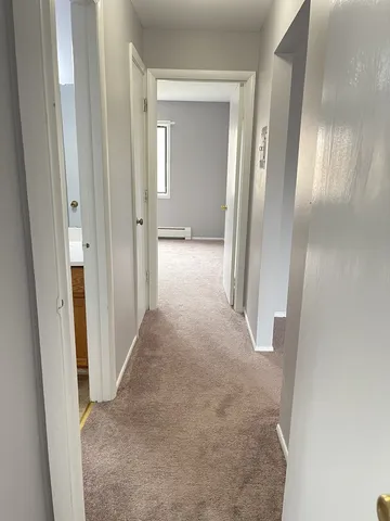 a bathroom with a sink toilet a mirror and shower