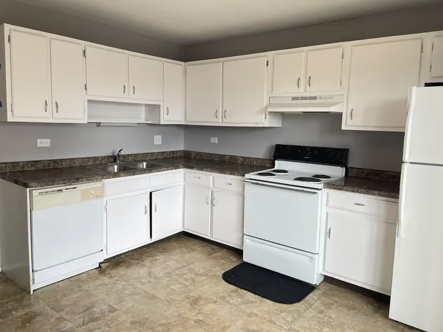 a view of storage and utility room with washer and dryer